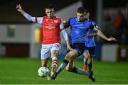 31 March 2023; Adam Murphy of St Patrick's Athletic in action against Jack Keaney of UCD during the SSE Airtricity Men's Premier Division match between St Patrick's Athletic and UCD at Richmond Park in Dublin. Photo by Ben McShane/Sportsfile