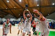 1 April 2023; Keelan Cairns of Emporium Cork Basketball celebrates with the trophy after the InsureMyVan.ie Super League final match between Emporium Cork Basketball and University of Galway Maree at National Basketball Arena in Tallaght, Dublin. Photo by Ben McShane/Sportsfile