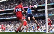2 April 2023; Daire Newcombe of Dublin has a shot on goal despite the efforts of Conor Doherty of Derry during the Allianz Football League Division 2 Final match between Dublin and Derry at Croke Park in Dublin. Photo by Sam Barnes/Sportsfile