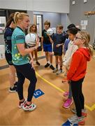 6 April 2023; Carla Rowe of Dublin with fourth grade students during a Ladies Football coaching clinic at the Casis Elementary School during the 2023 TG4 LGFA All-Star Tour to Austin in Texas, USA. Photo by Brendan Moran/Sportsfile