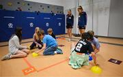 6 April 2023; Sinéad Cafferky, left, and Danielle Caldwell of Mayo with fifth grade students during a Ladies Football coaching clinic at the Casis Elementary School during the 2023 TG4 LGFA All-Star Tour to Austin in Texas, USA. Photo by Brendan Moran/Sportsfile