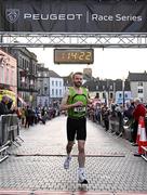 6 April 2023; Mitchell Byrne of Rathfarnham WSAF AC, Dublin, crosses the line to finish second in the Peugeot Race Series - Streets of Kilkenny 2023 in Kilkenny. Photo by Sam Barnes/Sportsfile