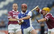 19 June 2004; Eoin Browne, Laois, in action against Enda Loughlin and Christo Mutagh, right, Westmeath. Guinness All-Ireland Hurling Championship Qualifier, Laois v Westmeath, O'Moore Park, Portlaoise, Co. Laois. Picture credit; Damien Eagers / SPORTSFILE