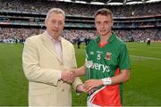 25 August 2013; Mayo's Michael Hall is presented with the Man of the Match award by Kevin Molloy, CRM, Electric Ireland. Electric Ireland GAA Football All-Ireland Minor Championship Semi-Final, Mayo v Monaghan, Croke Park, Dublin. Picture credit: Stephen McCarthy / SPORTSFILE