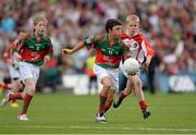 25 August 2013; Matthew Walsh, representing Breaffy N.S. Ballina, Co. Mayo, left, in action against Jack Kirrane, representing Scoil Náisiúnta Baile an Mhuilinn, Tuam, Co. Galway, right, during the INTO/RESPECT Exhibition GoGames at the GAA Football All-Ireland Senior Championship Semi-Final between Mayo and Tyrone. Croke Park, Dublin. Picture credit: Stephen McCarthy / SPORTSFILE