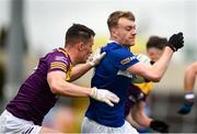 9 April 2023; Trevor Collins of Laois in action against Paraic Hughes of Wexford during the Leinster GAA Football Senior Championship Round 1 match between Laois and Wexford at Laois Hire O'Moore Park in Portlaoise, Laois. Photo by Tom Beary/Sportsfile