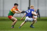 9 April 2023; Mark Kenny of Wicklow in action against Niall Hickey of Carlow during the Leinster GAA Football Senior Championship Round 1 match between Wicklow and Carlow at Echelon Park in Aughrim, Wicklow. Photo by Daire Brennan/Sportsfile