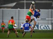 9 April 2023; Josh Moore of Carlow in action against Patrick O’Keane of Wicklow during the Leinster GAA Football Senior Championship Round 1 match between Wicklow and Carlow at Echelon Park in Aughrim, Wicklow. Photo by Daire Brennan/Sportsfile