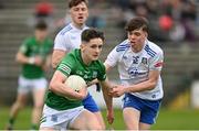 15 April 2023; Oisin Swift of of Fermanagh in action against Andrew Stuart of Monaghan during the Electric Ireland Ulster GAA Football Minor Championship Round 1 match between Fermanagh and Monaghan at Brewster Park in Enniskillen, Fermanagh. Photo by Ramsey Cardy/Sportsfile