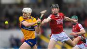 19 April 2023; Keith Smyth of Clare in action against Eoin Downey of Cork during the oneills.com Munster GAA Hurling U20 Championship Round 4 match between Clare and Cork at Cusack Park in Ennis, Clare. Photo by John Sheridan/Sportsfile