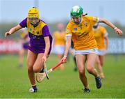 22 April 2023; Ellie Stafford of Wexford in action against Erin Coulter of Antrim during the Electric Ireland Camogie Minor A Shield Semi-Final match between Antrim and Wexford at Coralstown Kinnegad GAA in Westmeath. Photo by Stephen Marken/Sportsfile