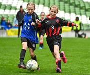 22 April 2023; Róise Gallagher of Kinvara United, Galway, in action against Siun Kelly of Mungret Regional FC, Limerick, during the Aviva Soccer Sisters Finals Day at the Aviva Stadium in Dublin. Photo by Sam Barnes/Sportsfile