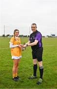 22 April 2023; Pictured are, referee John Burke and Cara O'Boyle of Antrim, who was named the Electric Ireland Player of the Match following her performance for Antrim in today’s Electric Ireland Camogie Minor A Shield All-Ireland Championship Semi-Final against Wexford at Coralstown Kinnegad GAA, in Kinnegad, Westmeath. Follow all the action in the Electric Ireland Camogie Minor Championships on social media @ElectricIreland and via the hashtag #ThisIsMajor, or for more information go to https://www.electricireland.ie/camogie-minor-championships. Photo by Stephen Marken/Sportsfile