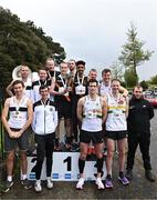 23 April 2023; Athletics Ireland Chair of Competitions Andrew Lynam, right, with senior men's medallists, Clonliffe Harriers AC, Dublin, gold, Donore Harriers, Dublin, silver, and St Abbans AC, Laois, bronze, during the 123.ie National Road Relay Championships at Raheny in Dublin. Photo by Sam Barnes/Sportsfile