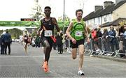 23 April 2023; Mahad Mohamed Egaal Jadda of Clonliffe Harriers AC C, left, and Paul Stephenson of Rathfarnham WSAF AC, Dublin, compete in the senior men's event during the 123.ie National Road Relay Championships at Raheny in Dublin. Photo by Sam Barnes/Sportsfile