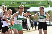 23 April 2023; Siobhan Eviston of Raheny Shamrock AC, Dublin, left, takes over from team-mate Kate Purcell whilst competing in the master women's 35+ event during the 123.ie National Road Relay Championships at Raheny in Dublin. Photo by Sam Barnes/Sportsfile