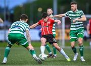 1 May 2023; Adam O'Reilly of Derry City in action against Lee Grace, left, and Markus Poom of Shamrock Rovers during the SSE Airtricity Men's Premier Division match between Derry City and Shamrock Rovers at The Ryan McBride Brandywell Stadium in Derry. Photo by Ramsey Cardy/Sportsfile