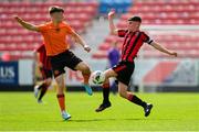 6 May 2023; Luke O'Connor of St Kevin's FC in action against Dane Mahon of Cherry Orchard FC during the FAI Under 17 Cup Final 2022/23 match between Cherry Orchard FC and St Kevin’s Boys FC at Richmond Park in Dublin. Photo by Tyler Miller/Sportsfile