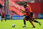 6 May 2023; Emmanual Ayoola of Cherry Orchard FC in action against Jack Allen of St Kevin's FC during the FAI Under 17 Cup Final 2022/23 match between Cherry Orchard FC and St Kevin’s Boys FC at Richmond Park in Dublin. Photo by Tyler Miller/Sportsfile