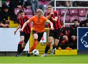 6 May 2023; Logan O'Connell of St Kevin's FC in action against Sean McLnerney of Cherry Orchard FC, left, and Sam Dunne during the FAI Under 17 Cup Final 2022/23 match between Cherry Orchard FC and St Kevin’s Boys FC at Richmond Park in Dublin. Photo by Tyler Miller/Sportsfile