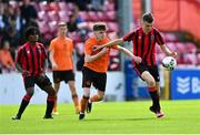 6 May 2023; Harry Philips of Cherry Orchard FC in action against Sam Dunne of St Kevin's FC during the FAI Under 17 Cup Final 2022/23 match between Cherry Orchard FC and St Kevin’s Boys FC at Richmond Park in Dublin. Photo by Tyler Miller/Sportsfile