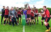 6 May 2023; Cherry Orchard FC players celebrate with the cup after their side's victory in the FAI Under 17 Cup Final 2022/23 match between Cherry Orchard FC and St Kevin’s Boys FC at Richmond Park in Dublin. Photo by Tyler Miller/Sportsfile