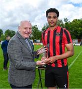 6 May 2023; Josh Okagbue of Cherry Orchard FC is presented with his player of the match award by FAI President Gerry McAnaney after the FAI Under 17 Cup Final 2022/23 match between Cherry Orchard FC and St Kevin’s Boys FC at Richmond Park in Dublin. Photo by Tyler Miller/Sportsfile