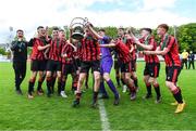 6 May 2023; Cherry Orchard FC players celebrate with the cup after their side's victory in the FAI Under 17 Cup Final 2022/23 match between Cherry Orchard FC and St Kevin’s Boys FC at Richmond Park in Dublin. Photo by Tyler Miller/Sportsfile