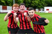 6 May 2023; Cherry Orchard FC players, from left, Evan Reel, Dane Mahon, and Kian Matthews celebrate after their side's victory in the FAI Under 17 Cup Final 2022/23 match between Cherry Orchard FC and St Kevin’s Boys FC at Richmond Park in Dublin. Photo by Tyler Miller/Sportsfile