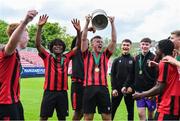 6 May 2023; Jack Cronin of Cherry Orchard FC, centre, celebrates with the cup after the FAI Under 17 Cup Final 2022/23 match between Cherry Orchard FC and St Kevin’s Boys FC at Richmond Park in Dublin. Photo by Tyler Miller/Sportsfile