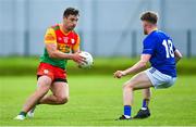 14 May 2023; Colm Hulton of Carlow in action against Joe Prendergast of Wicklow during the Tailteann Cup Group 3 Round 1 match between Wicklow and Carlow at Echelon Park in Aughrim, Wicklow. Photo by Tyler Miller/Sportsfile