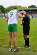 20 May 2023; Rory O'Donnell of Donegal is spoken to by referee James Molloy before being issued a yellow card for taking off his jersey during the GAA Football All-Ireland Senior Championship Round 1 match between Clare and Donegal at Cusack Park in Ennis, Clare. Photo by Ray McManus/Sportsfile