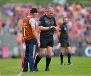 21 May 2023; Referee Johnny Murphy takes a note of Clare's Niall Romer's name before issuing him with a yellow card during the Munster GAA Hurling Senior Championship Round 4 match between Clare and Cork at Cusack Park in Ennis, Clare. Photo by Ray McManus/Sportsfile