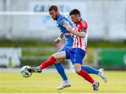 26 May 2023; Stephen Christopher of Treaty United in action against Ryan Flood of Finn Harps during the SSE Airtricity Men's First Division match between Treaty United and Finn Harps at Markets Field in Limerick. Photo by Michael P Ryan/Sportsfile