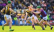 28 May 2023; TJ Reid of Kilkenny is tackled by Liam Ryan, centre, and Matthew O'Hanlon of Wexford during the Leinster GAA Hurling Senior Championship Round 5 match between Wexford and Kilkenny at Chadwicks Wexford Park in Wexford. Photo by Eóin Noonan/Sportsfile