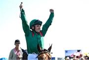 28 May 2023; Chris Hayes celebrates on Tahiyra as they enter the parade ring after winning the Tattersalls Irish 1,000 Guineas during the Tattersalls Irish Guineas Festival at The Curragh Racecourse in Kildare. Photo by David Fitzgerald/Sportsfile