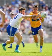 4 June 2023; Jamie Malone of Clare in action against Darren Hughes of Monaghan during the GAA Football All-Ireland Senior Championship Round 2 match between Monaghan and Clare at St Tiernach's Park in Clones, Monaghan. Photo by Daire Brennan/Sportsfile