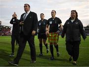 9 June 2023; Referee Rob Hennessy is escorted from the pitch by Cork City event controller Robbie Kelleher and head of security Carol O'Sulivan during the SSE Airtricity Men's Premier Division match between Cork City and Dundalk at Turner's Cross in Cork. Photo by Eóin Noonan/Sportsfile