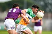 10 June 2023; Ruairi McNamee of Offaly is tackled by Brian Molloy of Wexford during the Tailteann Cup Preliminary Quarter Final match between Offaly and Wexford at Glenisk O'Connor Park in Tullamore, Offaly. Photo by Tom Beary/Sportsfile