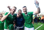 11 June 2023; Limerick players, from left, William O'Donoghue, Sean Finn and Kyle Hayes celebrate after the Munster GAA Hurling Championship Final match between Clare and Limerick at TUS Gaelic Grounds in Limerick. Photo by John Sheridan/Sportsfile