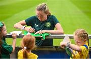 16 June 2023; Megan Connolly signs autographs for supporters during a Republic of Ireland women open training session at UCD Bowl in Dublin. Photo by Ramsey Cardy/Sportsfile