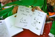 16 June 2023; A supporter holds a message for the players during a Republic of Ireland women open training session at UCD Bowl in Dublin. Photo by Ramsey Cardy/Sportsfile