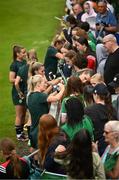 16 June 2023; Lily Agg and team-mates with supporters during a Republic of Ireland women open training session at UCD Bowl in Dublin. Photo by Ramsey Cardy/Sportsfile