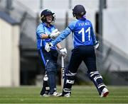 18 June 2023; Laura Delany of Typhoons, left, celebrates with teammate Robyn Searle after celebrates after bringing up her century during the Evoke Super Series 2023 match between Typhoons and Dragons at YMCA Sports Ground on Claremont Road, Dublin. Photo by Piaras Ó Mídheach/Sportsfile