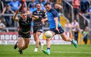 18 June 2023; Colm Basquel of Dublin scores his side's second goal despite the tackle of Jack Lavin of Sligo during the GAA Football All-Ireland Senior Championship Round 3 match between Dublin and Sligo at Kingspan Breffni in Cavan. Photo by Ramsey Cardy/Sportsfile