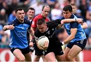 18 June 2023; Paul McNamara of Sligo is tackled by Colm Basquel, left, and Lorcan O'Dell of Dublin during the GAA Football All-Ireland Senior Championship Round 3 match between Dublin and Sligo at Kingspan Breffni in Cavan. Photo by Ramsey Cardy/Sportsfile