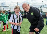 18 June 2023; FAI President Gerry McAnaney presents medals to players after the Football For All National Blitz on the Sport Ireland Campus in Dublin. Photo by Seb Daly/Sportsfile