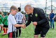 18 June 2023; FAI President Gerry McAnaney presents medals to players after the Football For All National Blitz on the Sport Ireland Campus in Dublin. Photo by Seb Daly/Sportsfile