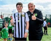 18 June 2023; FAI President Gerry McAnaney presents medals to players after the Football For All National Blitz on the Sport Ireland Campus in Dublin. Photo by Seb Daly/Sportsfile