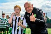 18 June 2023; FAI President Gerry McAnaney presents medals to players after the Football For All National Blitz on the Sport Ireland Campus in Dublin. Photo by Seb Daly/Sportsfile